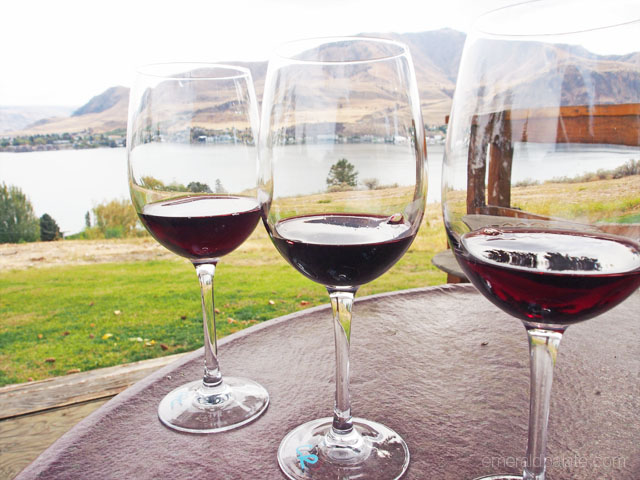 wine glass flight overlooking a lake at one of the best Seattle for foodies wine destinations