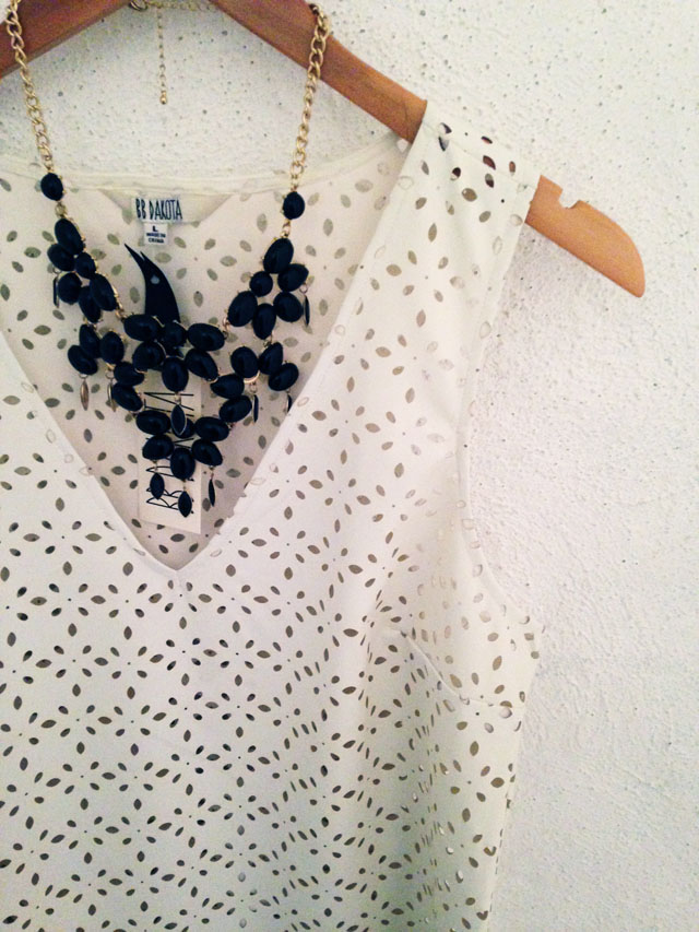 black statement necklace and white tank