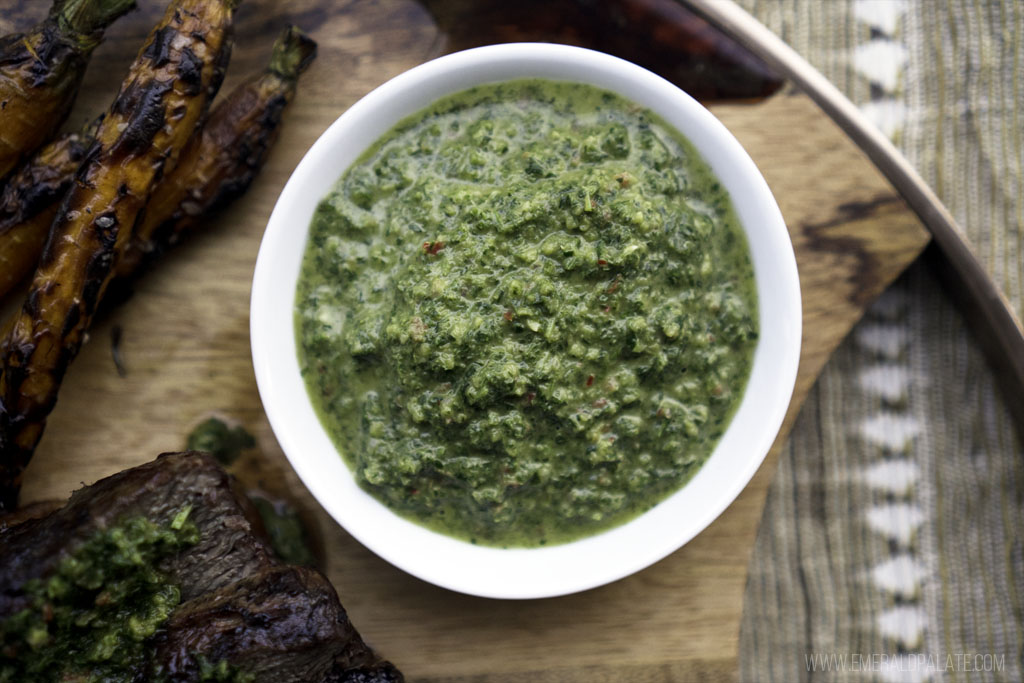 close up of a bowl of carrot top chimichurri