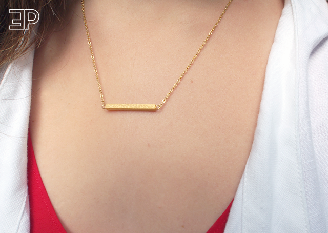 this delicate gold bar necklace is just the right amount of bling for a casual weekend uniform. - via The Emerald Palate