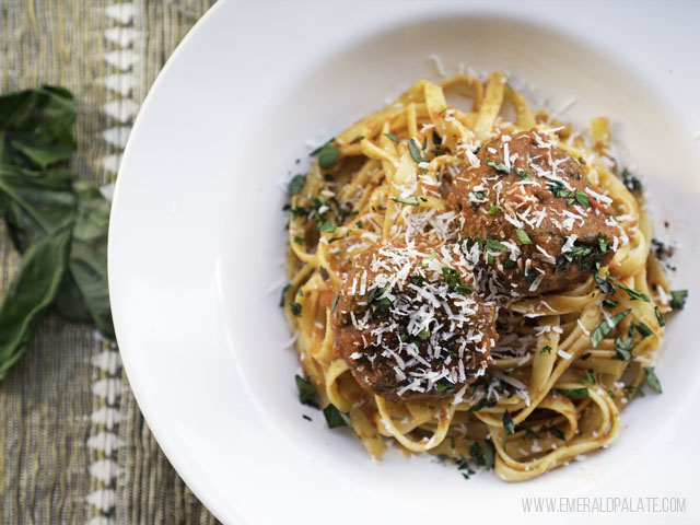 romanesco and lentil vegetarian meatballs with red sauce over spaghetti