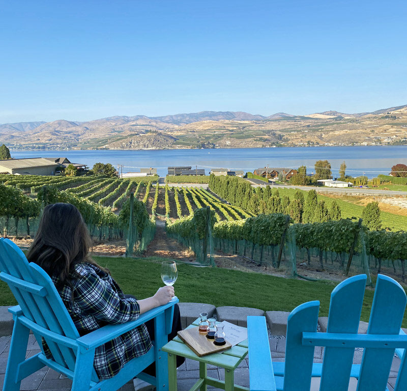 women sipping wine from a patio at one of the best wineries in Lake Chelan