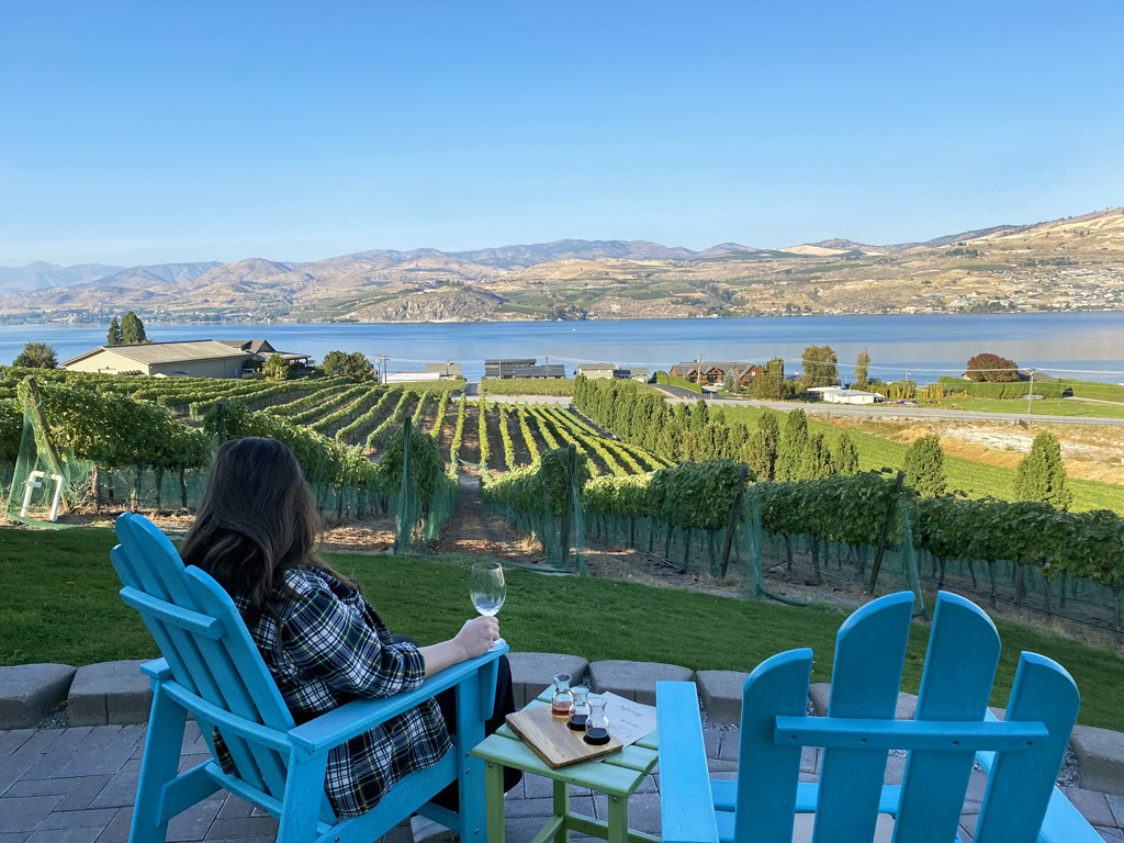 women sipping wine from a patio at one of the best wineries in Lake Chelan