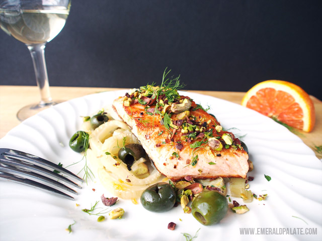 This easy and healthy salmon recipe is served with roast oranges, fennel, olives, and a pistachio-cacao nib gremolata. Perfect for Valentine's Day!