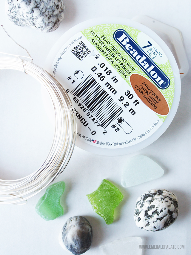 All the supplies you need to make an affordable, easy DIY necklace using sea glass or stones found on the beach!