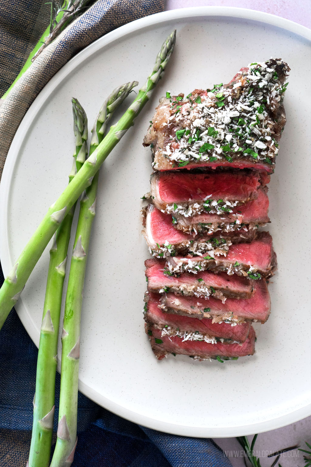 plate of steak sliced and served with asparagus