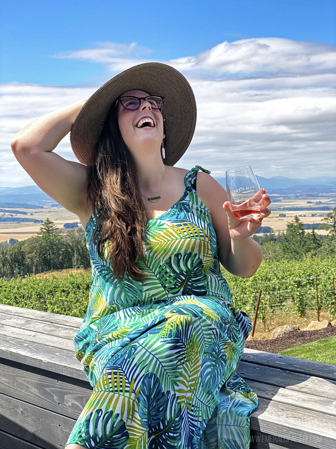 woman laughing and drinking wine at one of the best Willamette Valley wineries