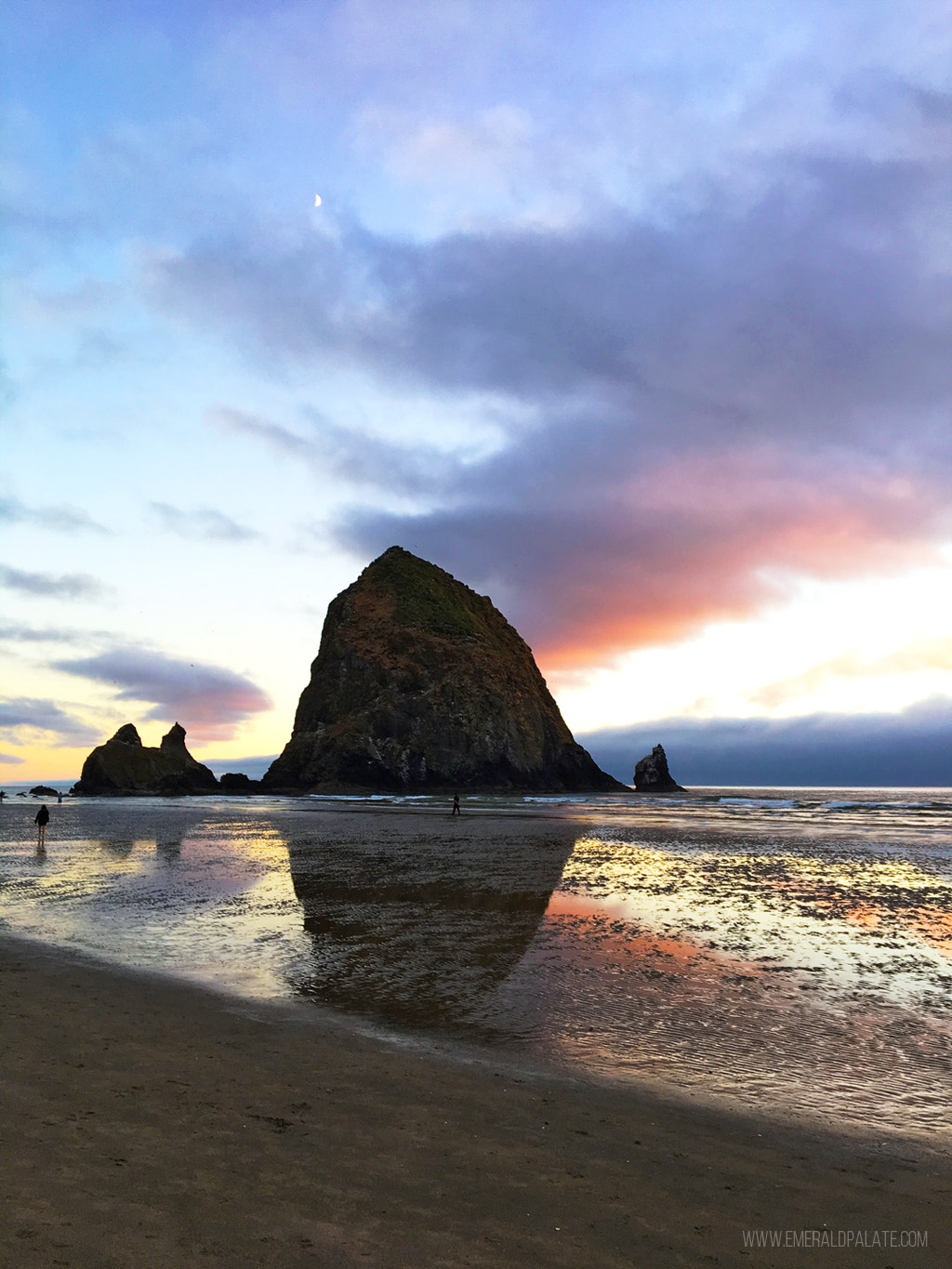 view of Haystack Rock on Cannon Beach in Oregon at sunset