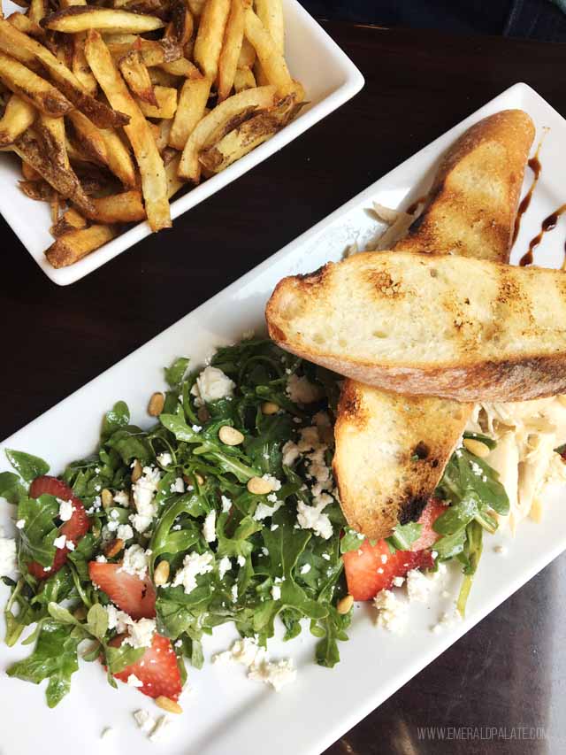 Goat cheese, arugula, and strawberry salad with chicken at the Beach Store Cafe