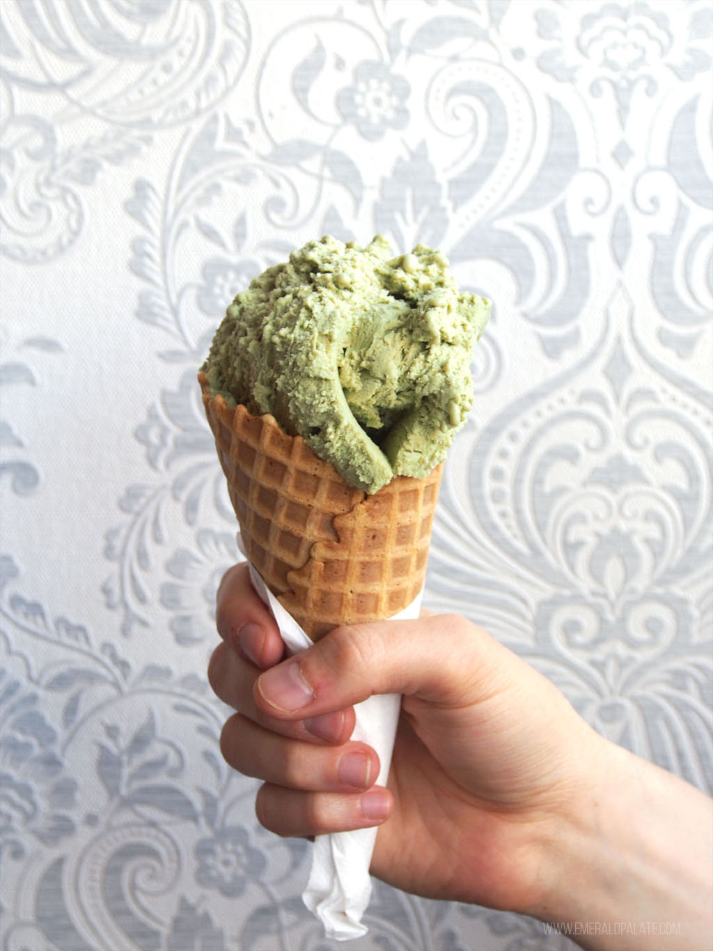 pistachio gelato in a cone from one of the best Seattle ice cream shops