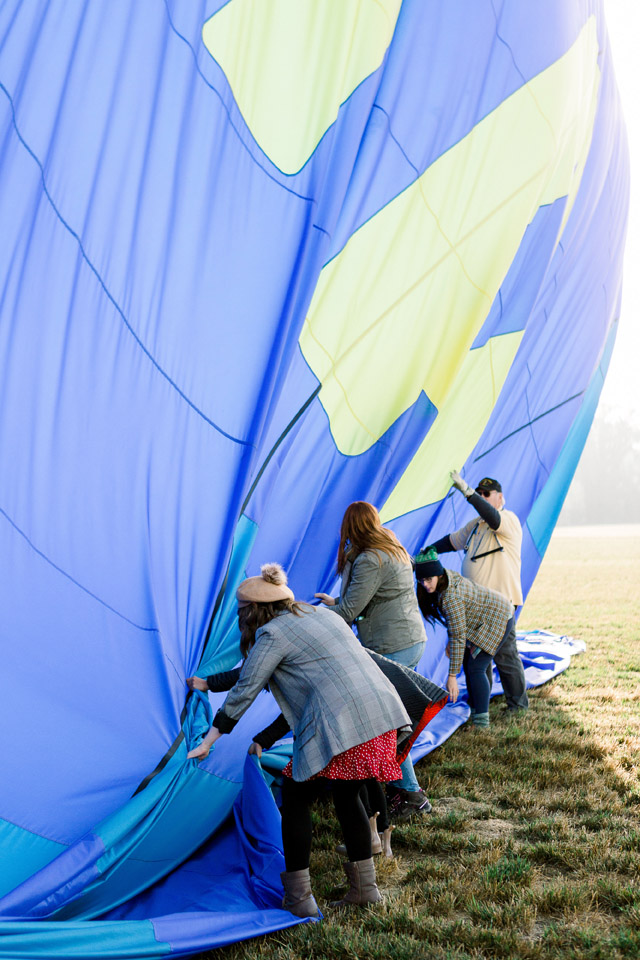 Breaking down a hot air balloon after a hot air balloon ride over wineries in Oregon. Hands down one of the top things to do in Oregon and one of the best things to do in Willamette Valley!