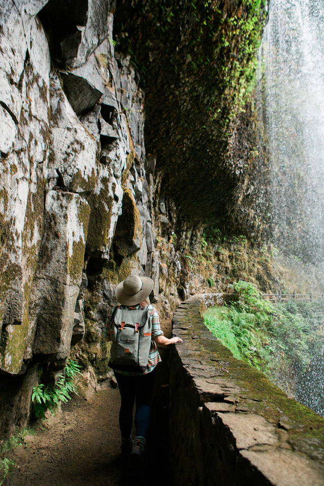 The walk in caves behind the waterfall at Silver Falls State Park in Oregon. It is one of the best hikes near Portland!  If you are looking for the best Oregon hikes, easy Oregon hikes, waterfall hikes, Oregon waterfalls, the best things to do in Oregon, family-friendly hikes, the best things to do in Willamette Valley, you will find it in Silver Falls State Park!