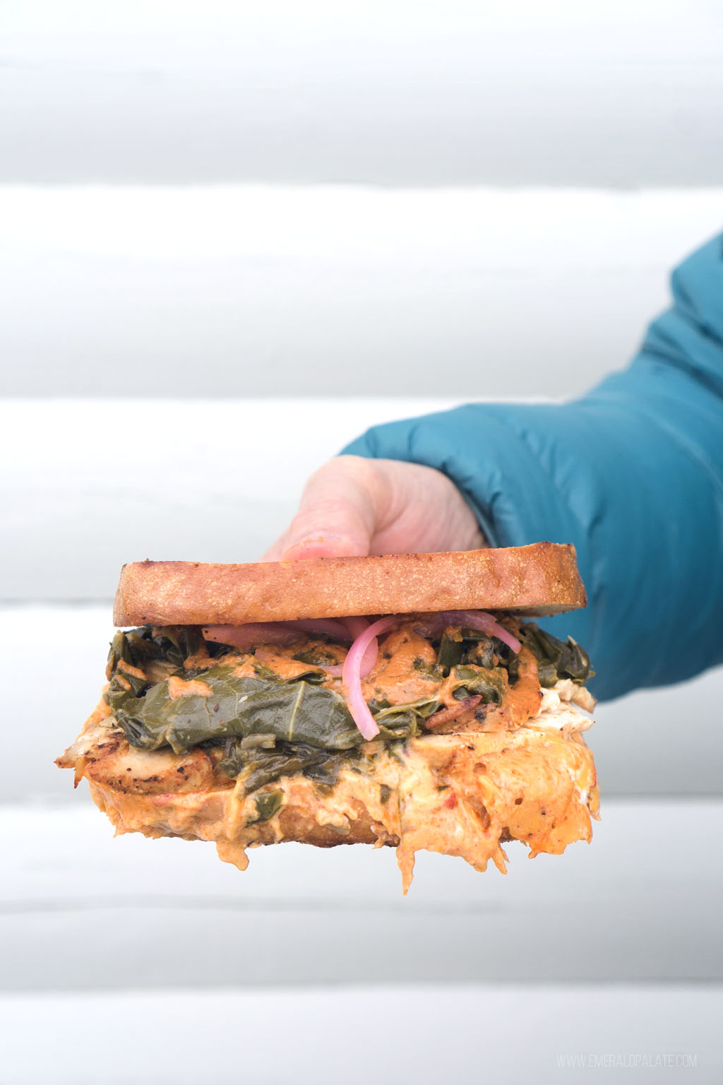 person holding messy sandwich from a place to eat in Leavenworth, WA