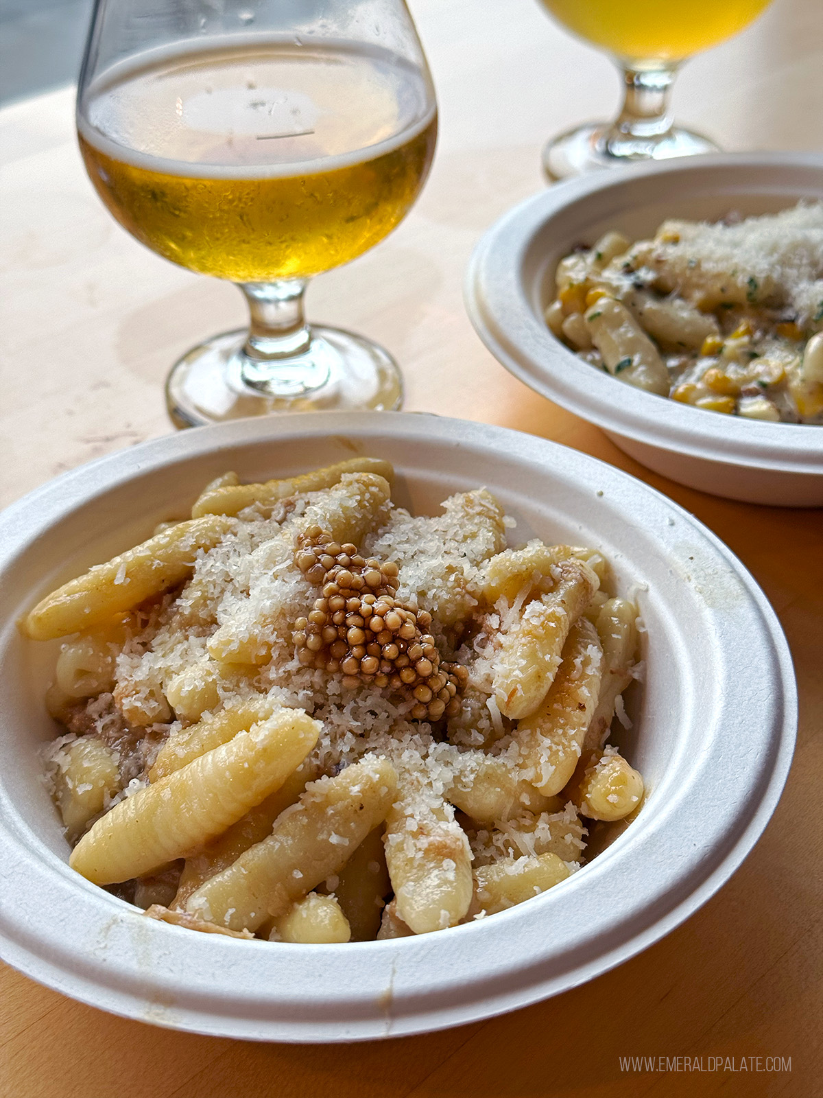 Cavatelli pasta with beer in the background