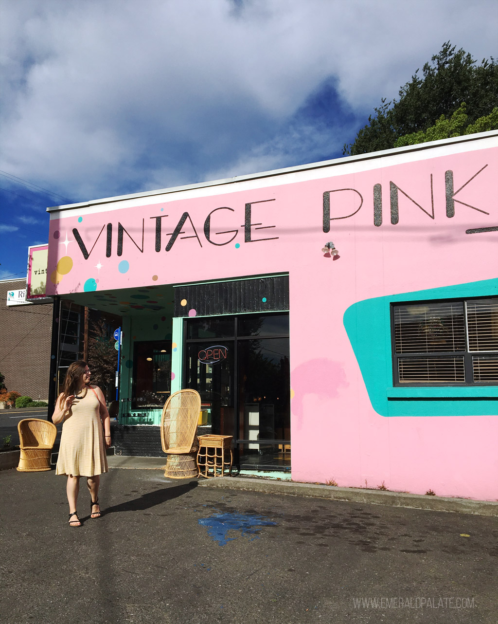 woman walking outside Vintage Pink, a must visit mid century modern antique store on your Portland itinerary