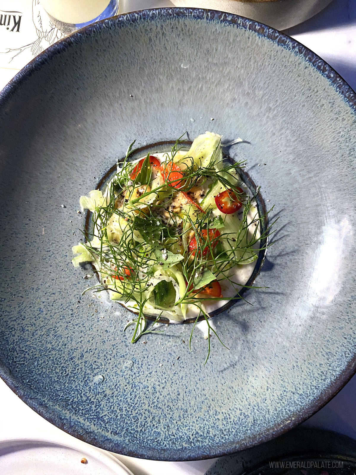 pretty plate of cured mussels with dill from a San Diego restaurant