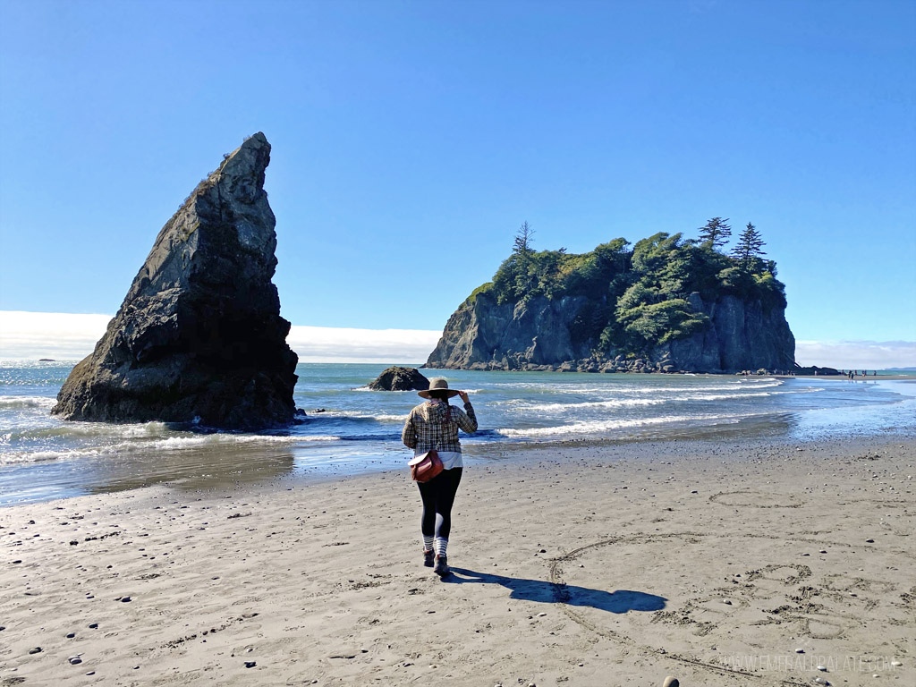 woman walking on Ruby Beach, one of the best Washington coast attractions