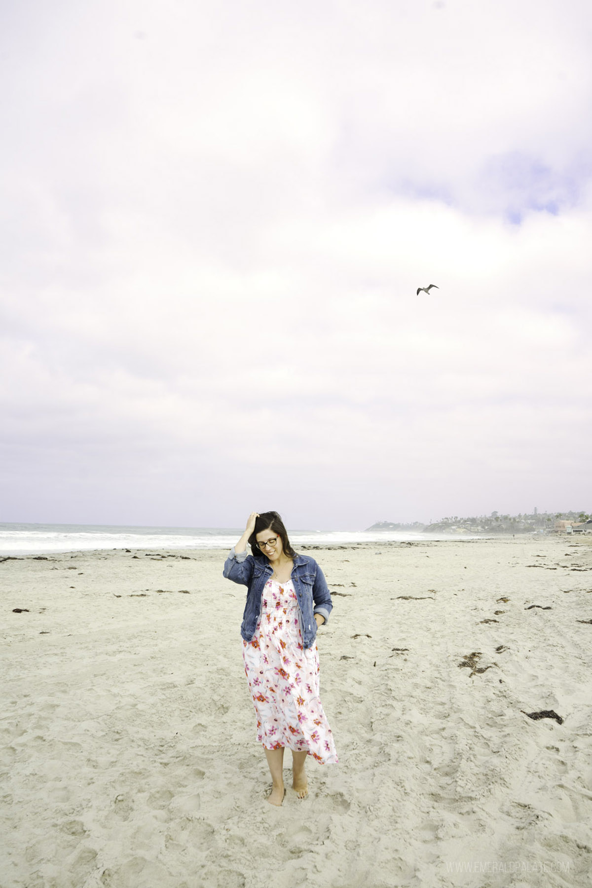 woman walking on a San Diego beach