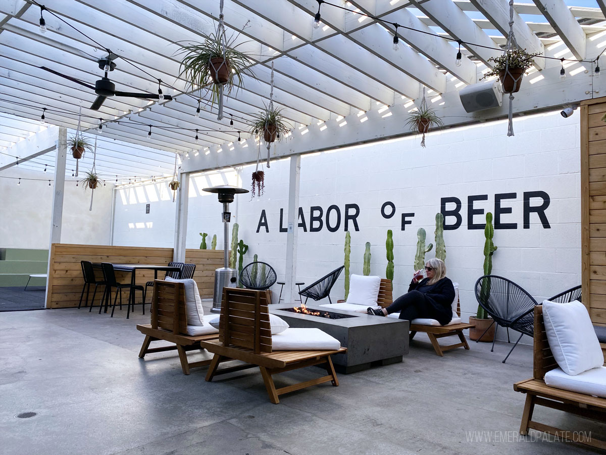 woman enjoying beer at one of the best San Diego breweries