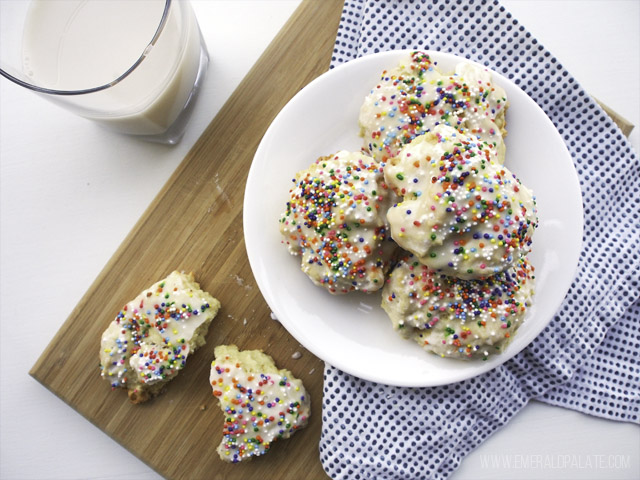 Italian lemon drop cookies with sprinkles on a plate and served with milk