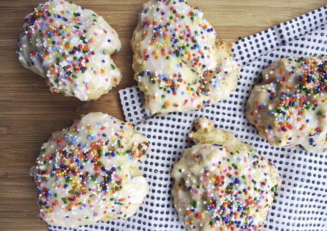 Close up of Italian decorated lemon cookies with rainbow sprinkles and icing