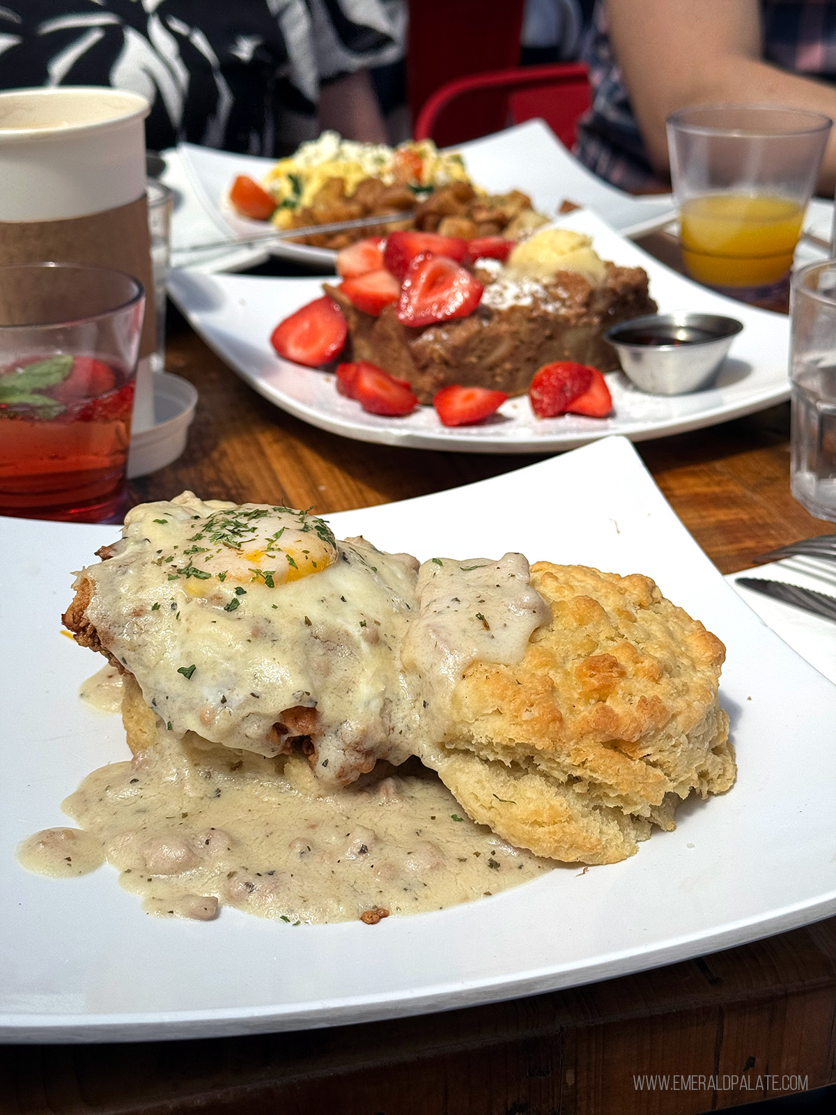 biscuits and gravy sandwich with fried chicken and an egg