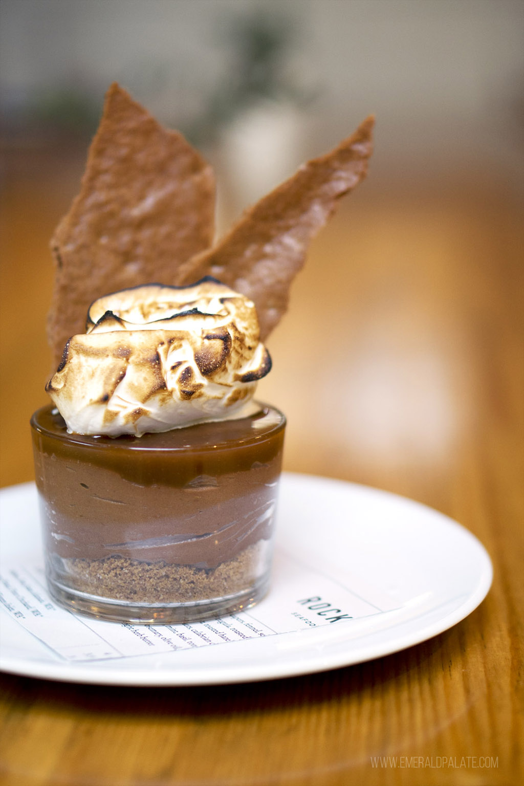 chocolate mousse dessert in a cup with a huge graham cracker sticking out