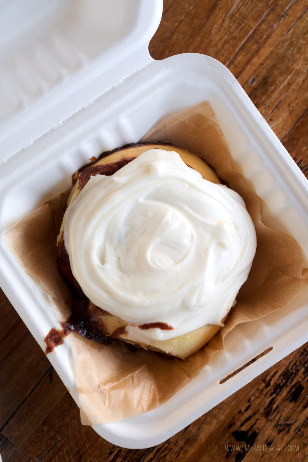 cinnamon roll with icing from one of the best dessert places in Seattle
