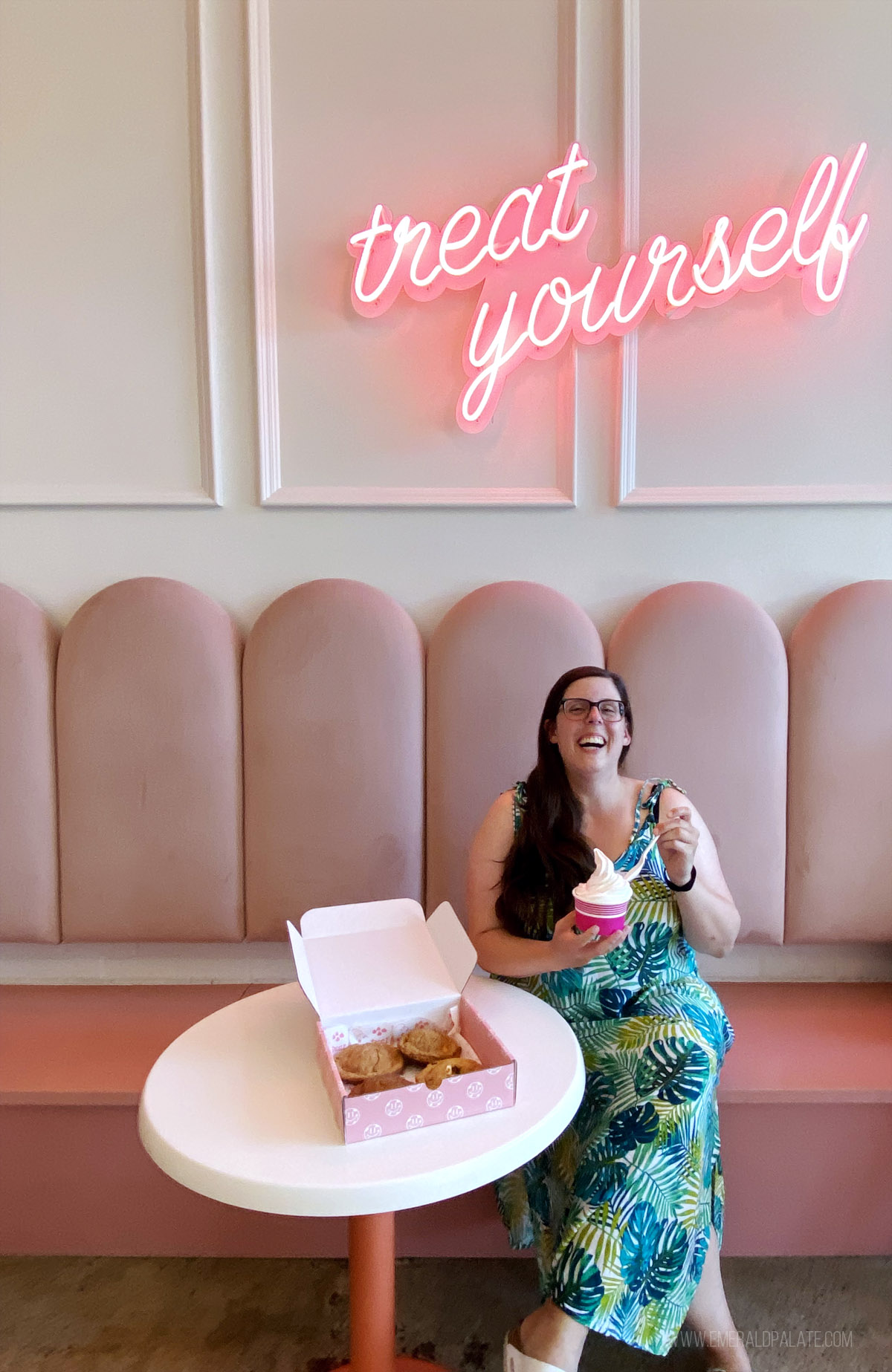 woman enjoying ice cream and cookies in a Seattle bakery
