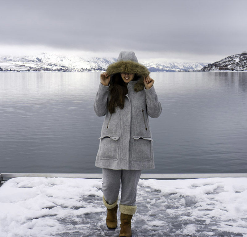 woman in winter coat exploring things to do in Lake Chelan in winter