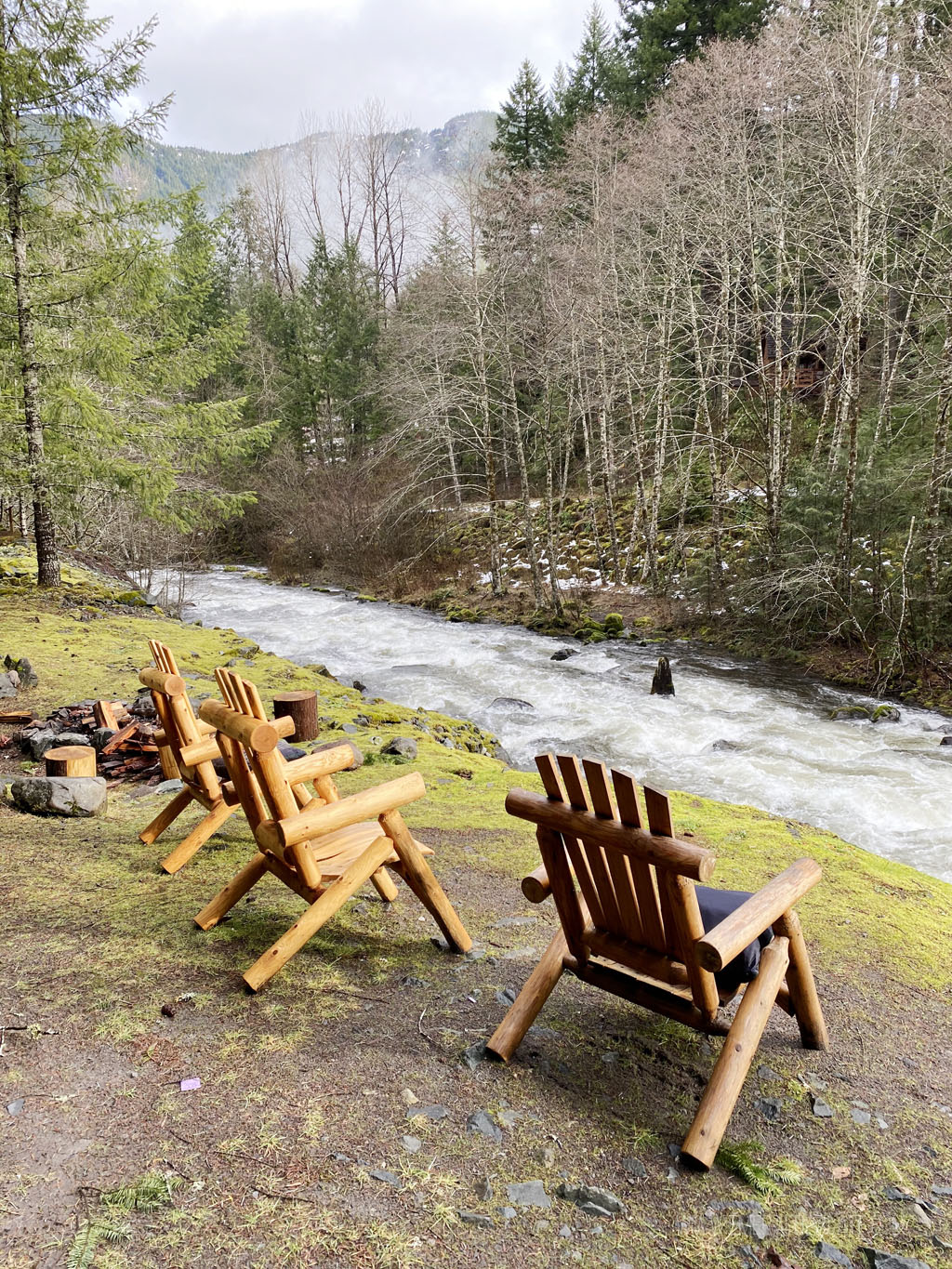 Adirondack chairs overlooking a river near Mt. Hood skiing areas