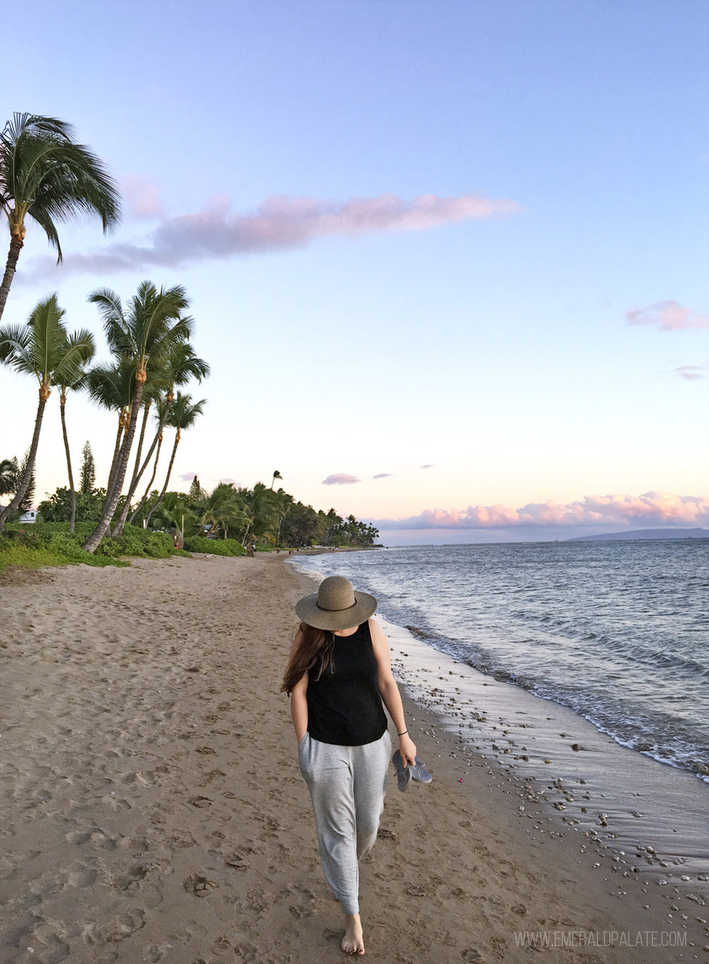 woman walking along the beach during a 5 day Maui itinerary