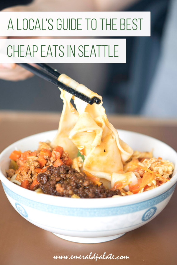 person pulling noodles with chopsticks at one of the best cheap restaurants in Seattle