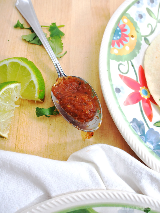 closeup of jarred sauce on a spoon, an essential for when you are stocking your pantry for the first time