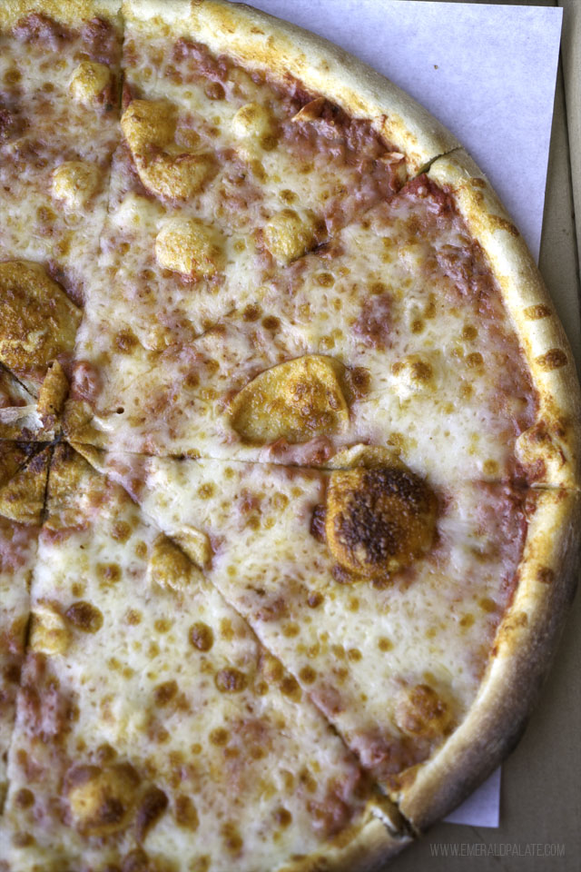 half a cheese pie with bubbles from a Seattle pizzeria