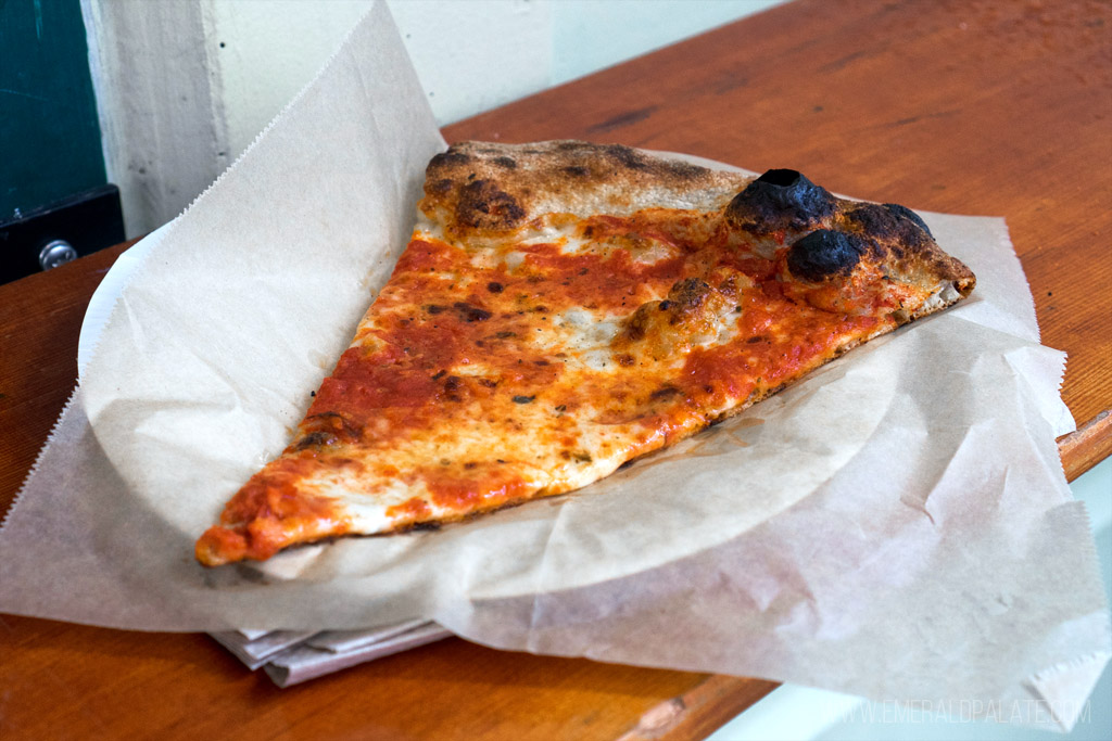 slice of New York style pizza from a Seattle pizza shop