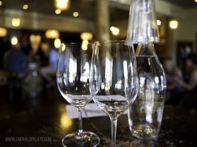 Closeup of wine tasting glasses in a roundup of Seattles best wine stores