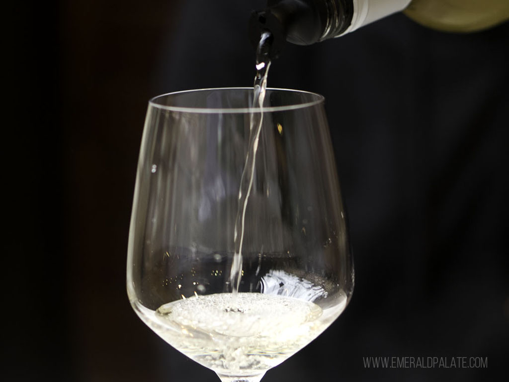 white wine being poured at one of the Black-owned wineries in the US