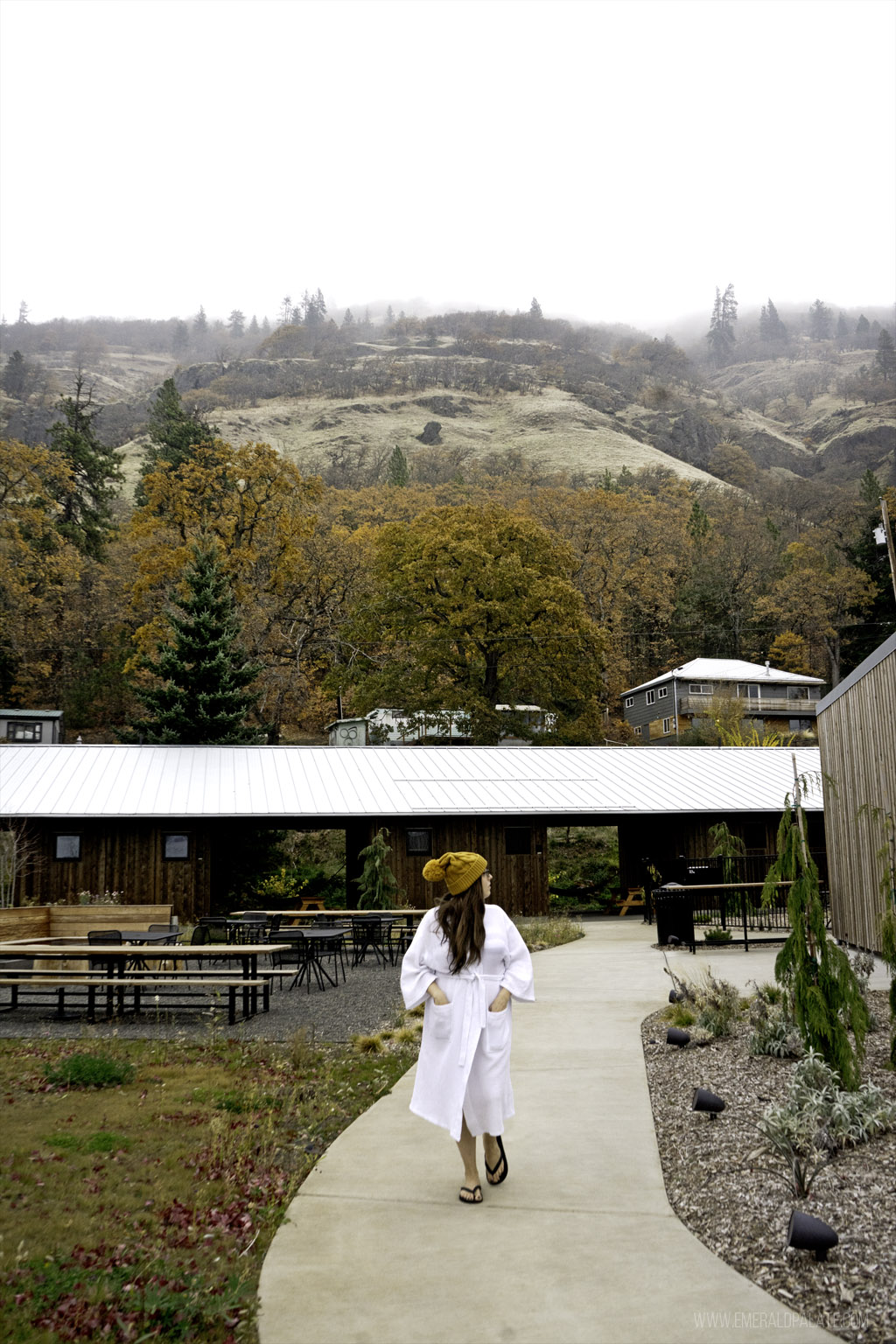 woman in a robe on the way to the spa at a unique hotel