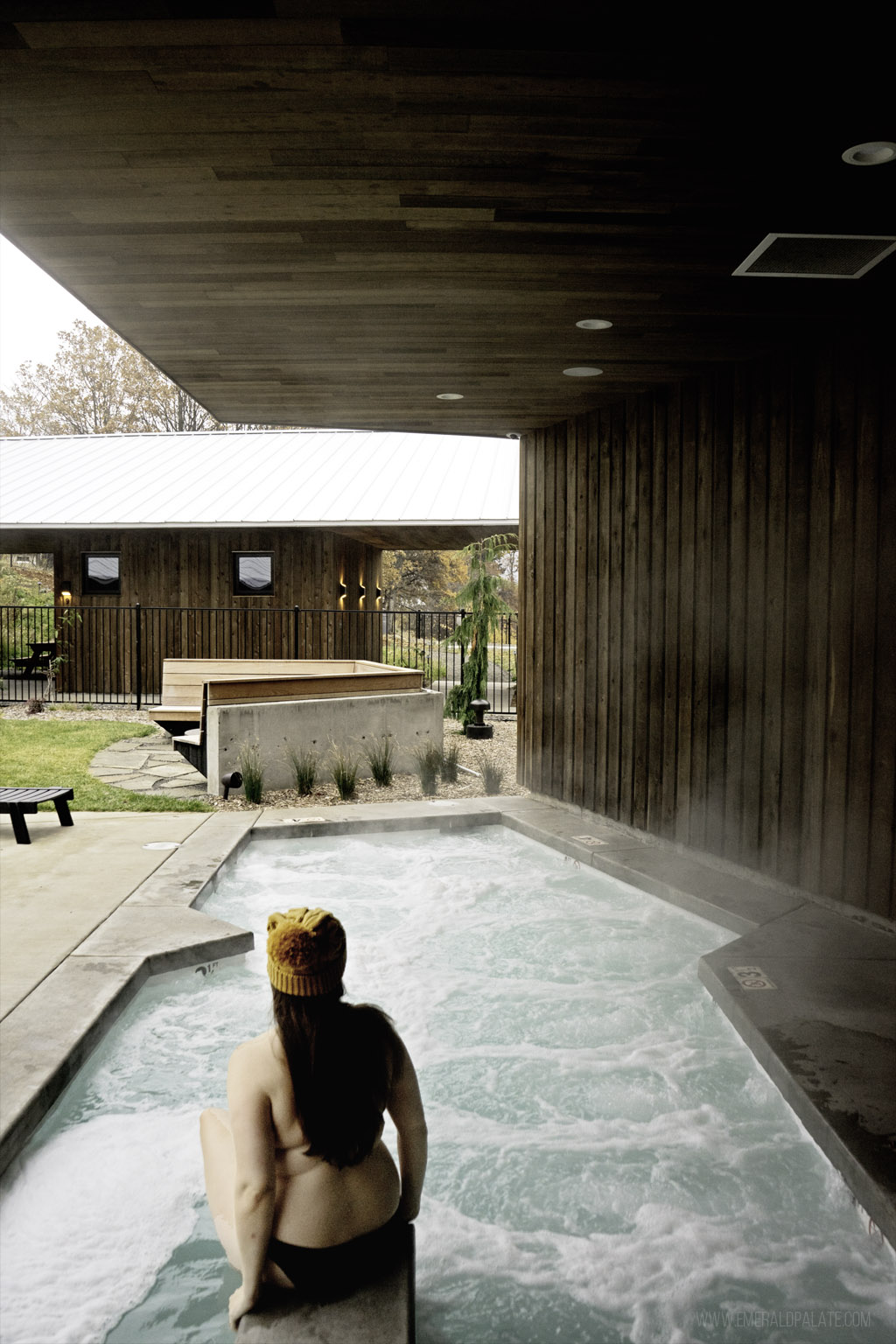 woman in an outdoor hot tub at a unique Washington hotel