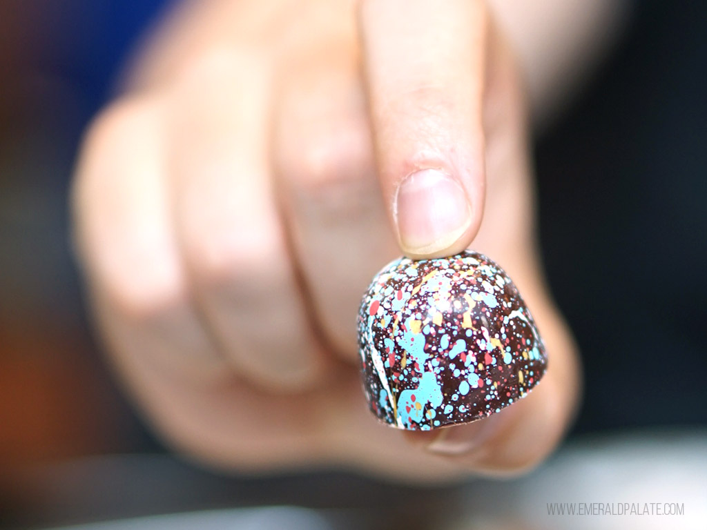 close up of person holding chocolate made in Seattle