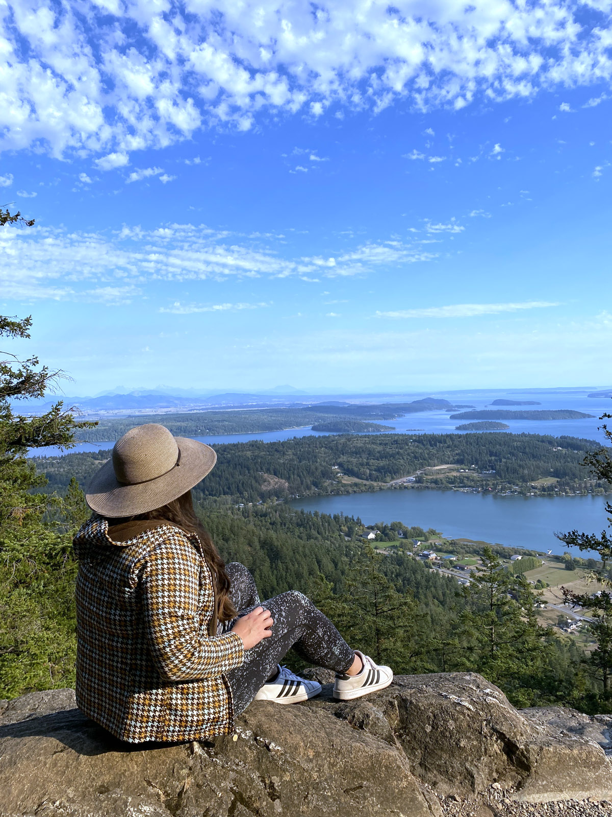 woman enjoying views from Mt Erie, one of the best things to do in Skagit County
