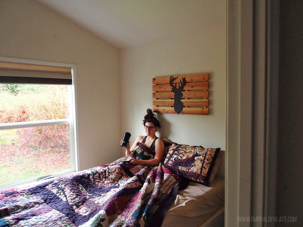 woman in bed at a cabin near Seattle tulip festival