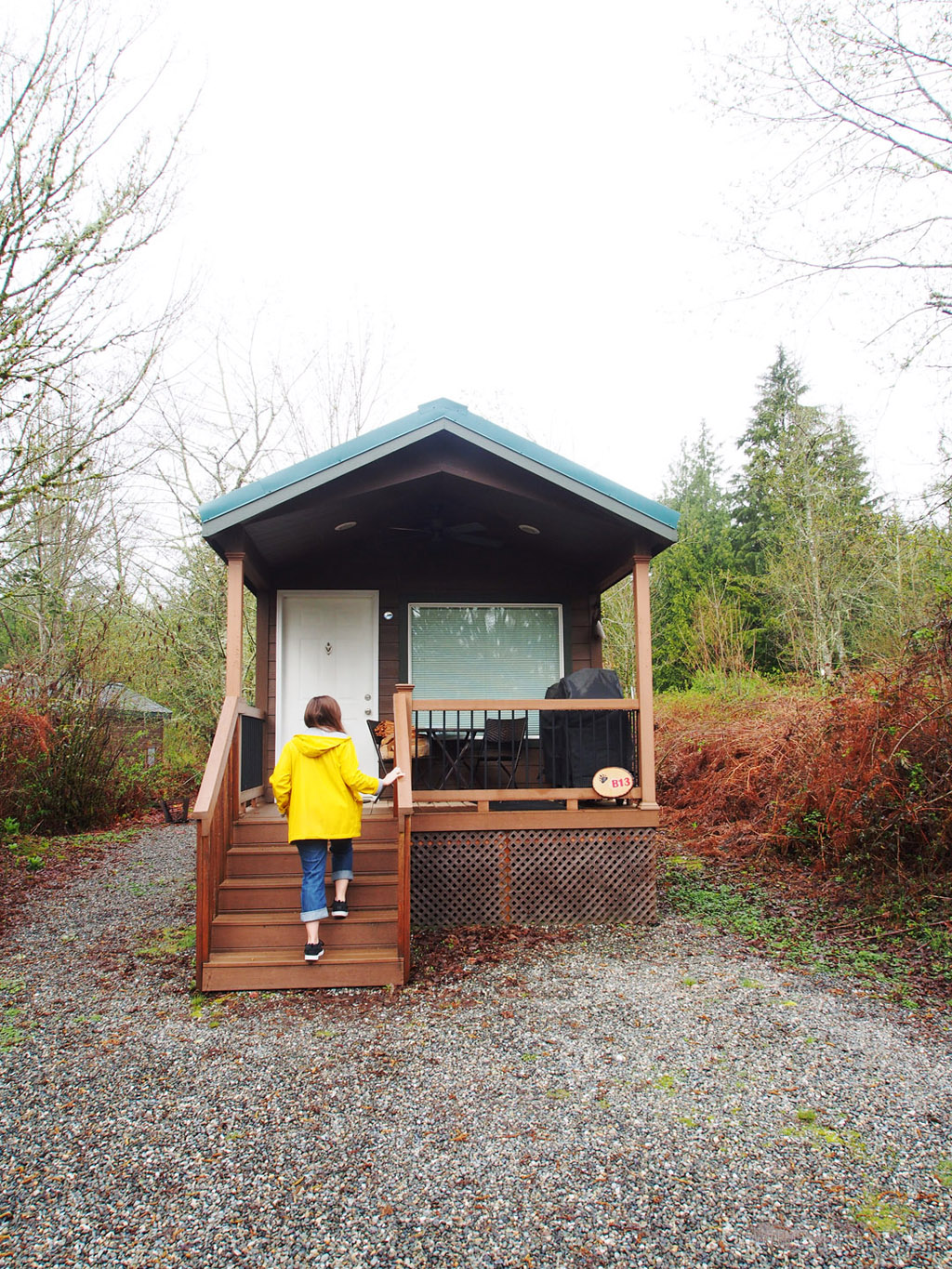 woman walking up porch of cabin near Skagit Valley Tulip Festival