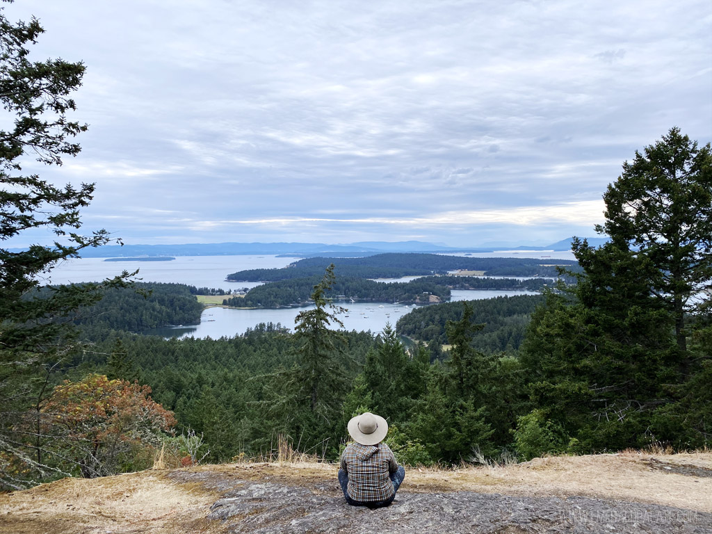 woman overlooking Salish Sea on Young Hill, a must visit if you have one day in San Juan Island