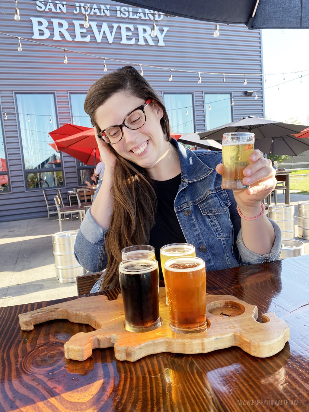 woman enjoying beer tasting flight at San Juan Island Brewery