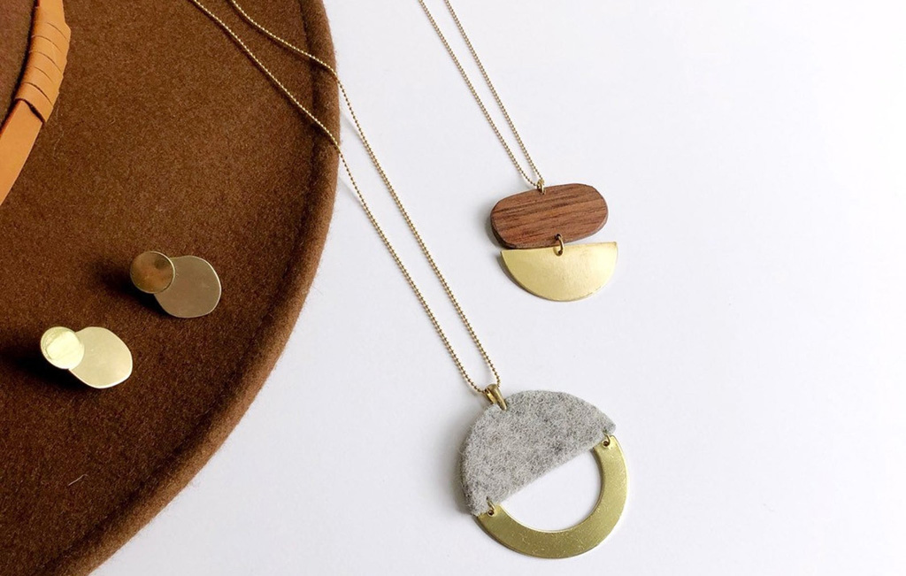 concrete, wood, and brass minimalist necklace from a Seattle jewelry maker