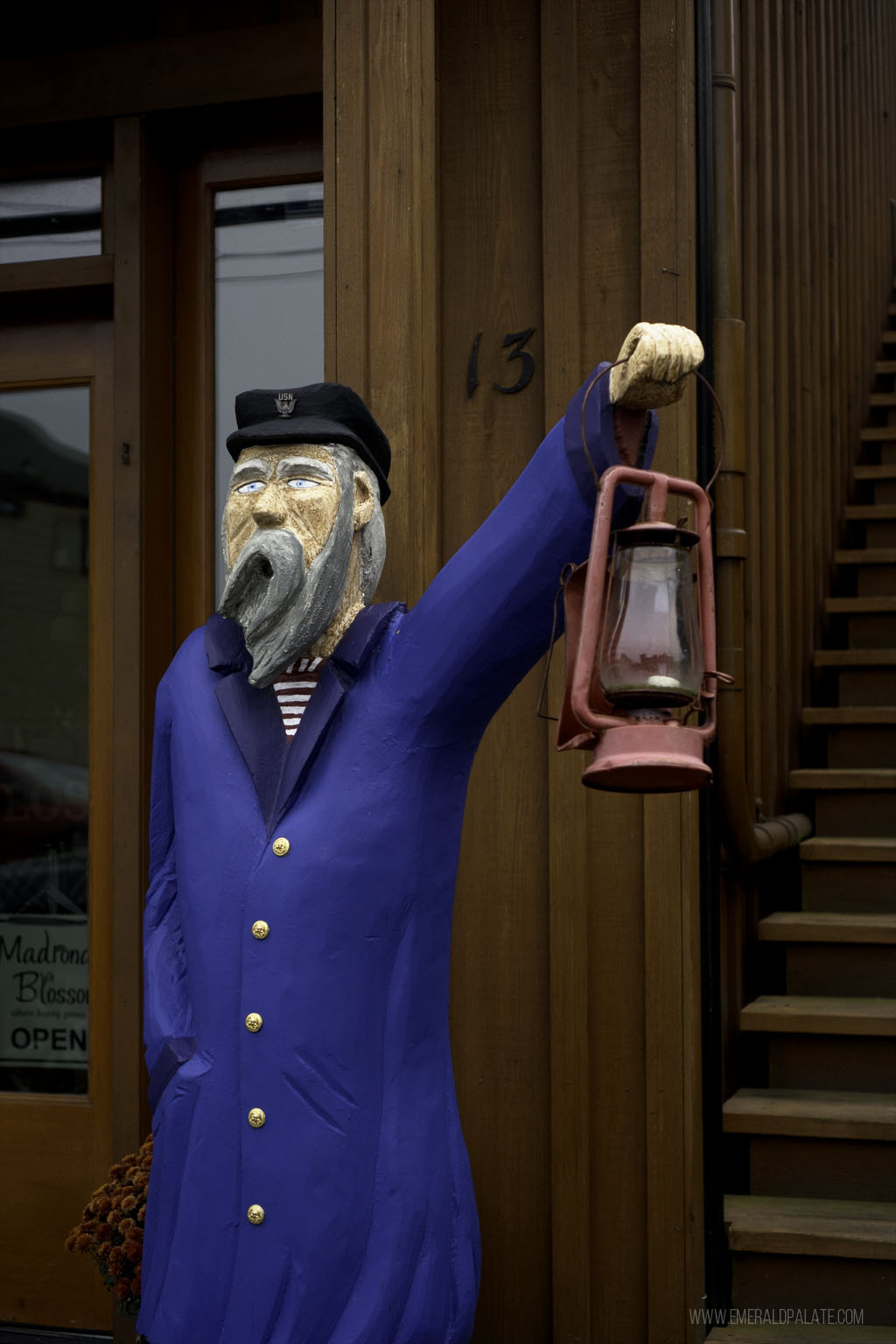 fisherman holding lantern sculpture on Coupeville 