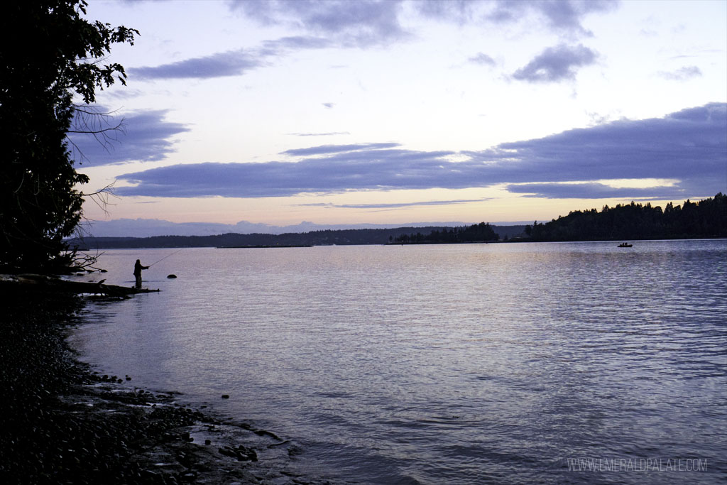 person fishing at sunset on an island near Seattle, Washington