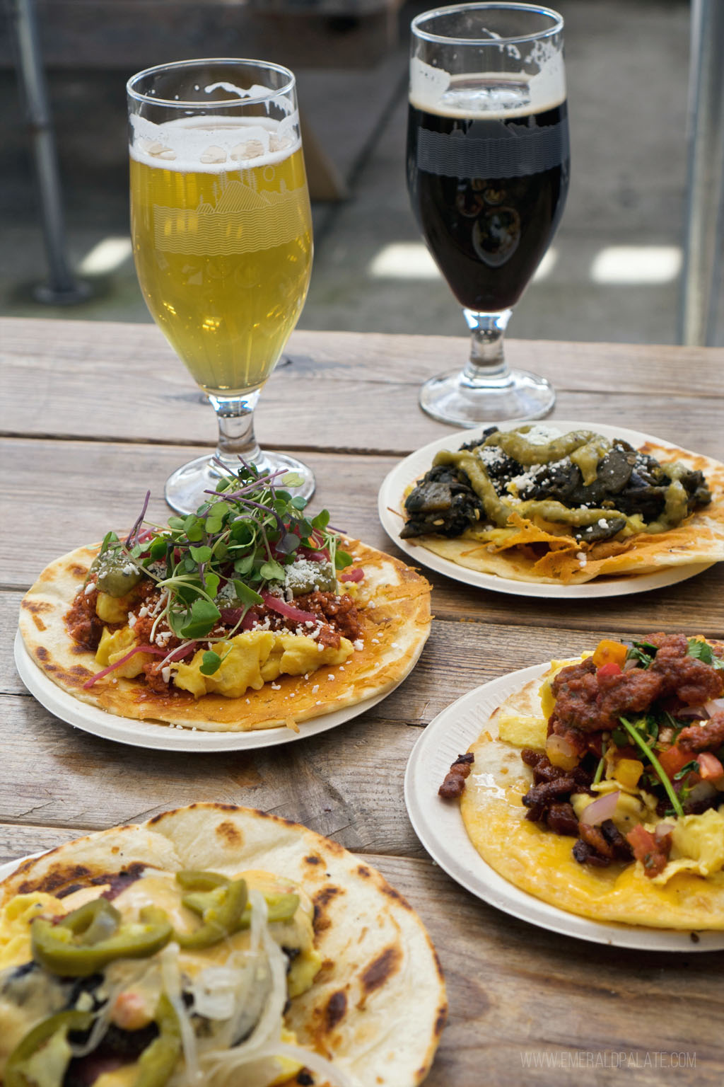 picnic table full of breakfast tacos and beer